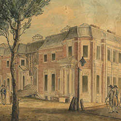 Two story red brick residence under construction. Men and women pedestrians walk around nearby grounds, including man carrying a ladder.